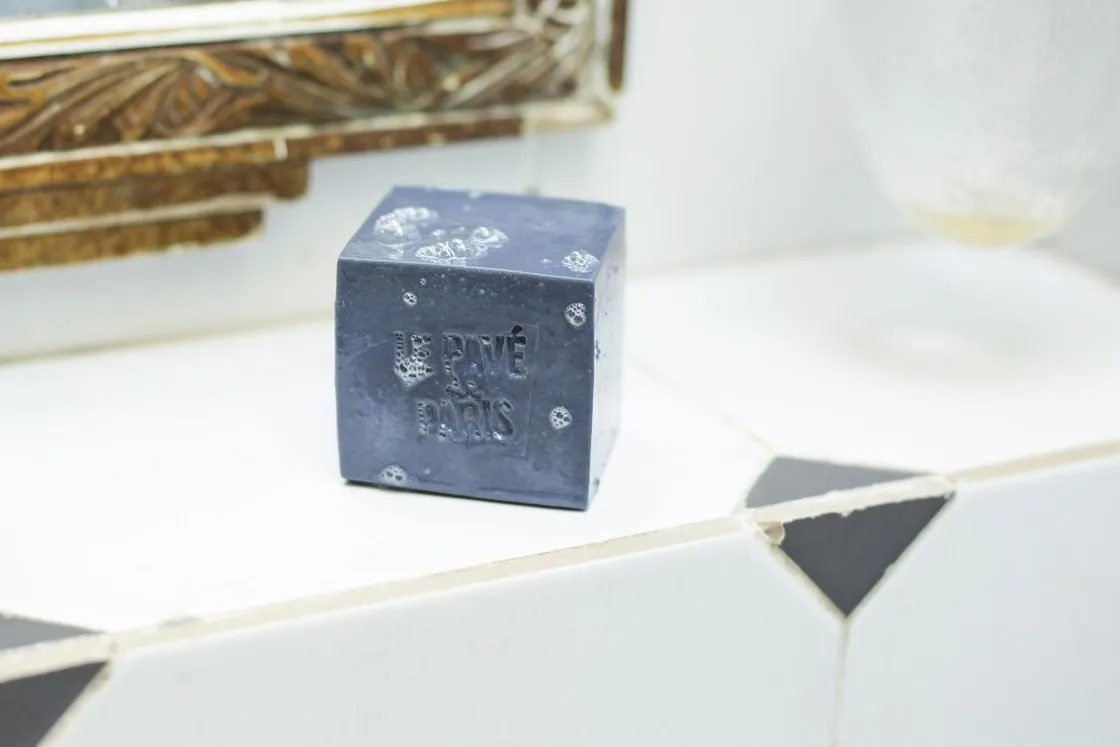 A Le Pavé de Paris soap beside a washbasin